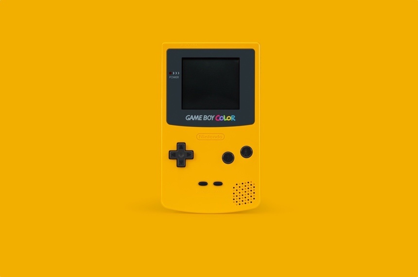 A handheld game console on a yellow background